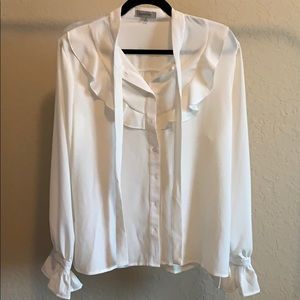 Passport long sleeve ruffle blouse